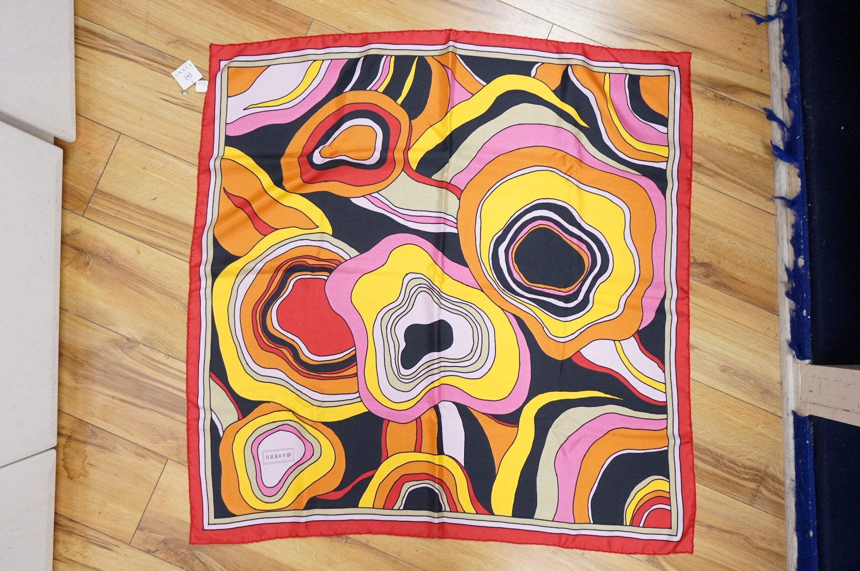 Three silk scarves comprising a Burberry check example, Christian Dior monogrammed and a Vakko abstract patterned example